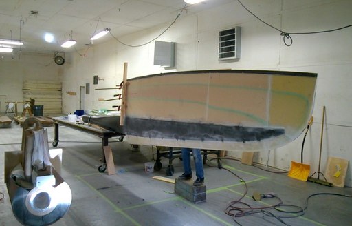 Man works on new keel and rudder for sailing yacht Axia