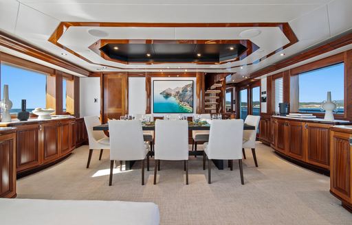 Charter yacht RULE NO.1 interior dining area surrounded by windows