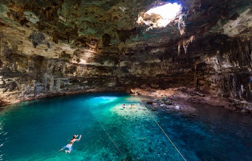 People diving in cave