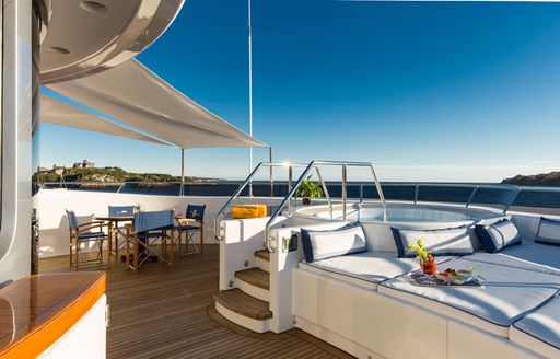 Jacuzzi surrounded by sun pads on charter yacht ‘Blue Moon’