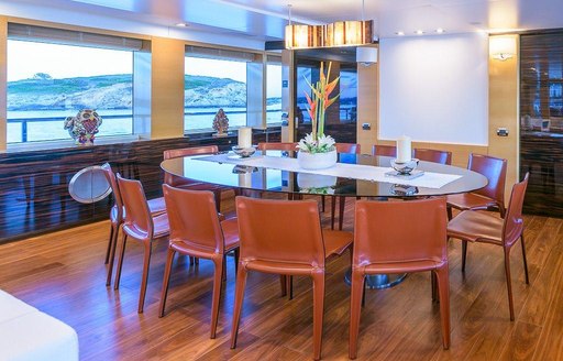 oval-shaped dining table in the main salon of motor yacht Africa I