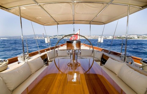 Shaded cockpit on board superyacht Aurelius 111 with al fresco dining and seating