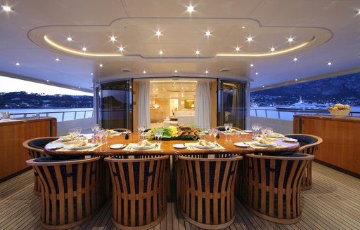 dining table is prepared for an alfresco dinner abroad luxury yacht CAPRI 