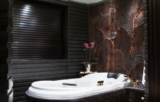 A white tiled bath on board superyacht KISMET