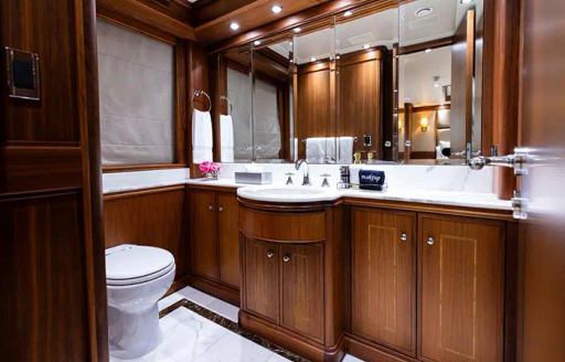 Ensuite with large sink unit onboard charter yacht INVICTUS