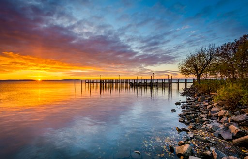 Sunrise over dock and the Chesapeake Bay, in Havre de Grace, Maryland.