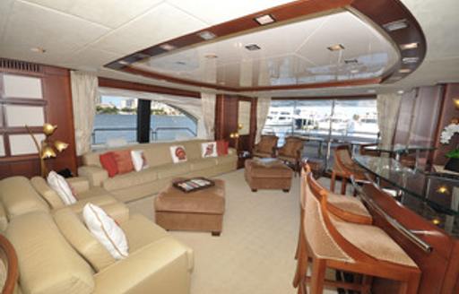 Interior lounge area with cream sofas and large windows