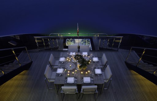 aerial view of alfresco dining on upper deck aft of superyacht Ocean Emerald 