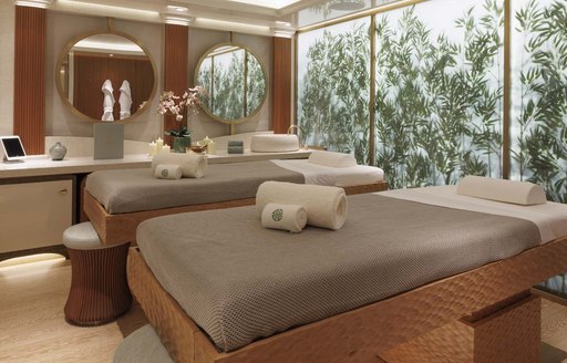 Massage beds in the spa area onboard, decorated with bamboo wall feature 