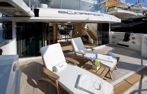 sun loungers line up on the beach club of motor yacht SCORPION 