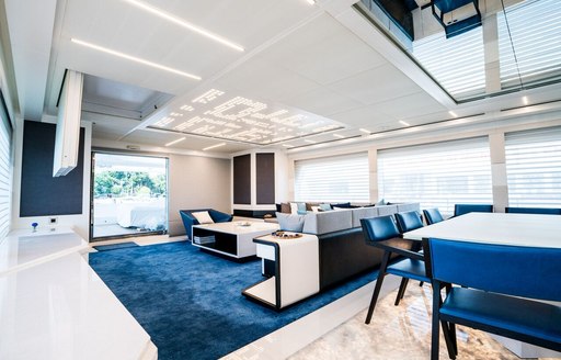 A graphic rendering illustrating the blue and white furnishings inside of superyacht SERENITAS II