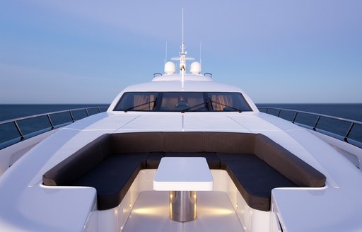 secluded sun pads and seating area on foredeck of motor yacht QUANTUM 