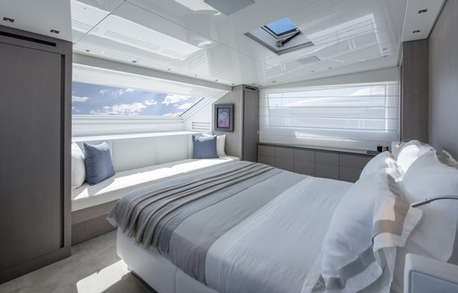 large bed in the master suite on board motor yacht DINAIA 