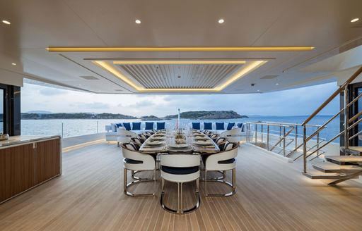 Charter yacht LASATA exteriors with central dining table