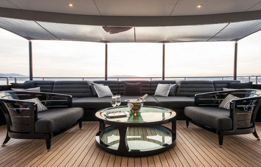 built-in sofas and armchairs on the outdoor deck aboard motor yacht BLISS 