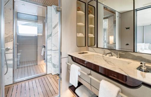 Ensuite facility with large sink and shower cubicle onboard charter yacht MIKOH