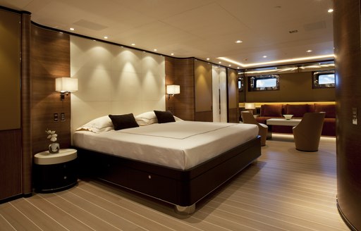 full-beam master suite with seating area on board luxury yacht FIDELIS 