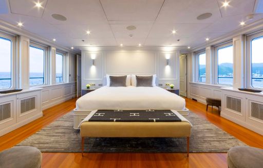 Master cabin with dual aspect windows onboard charter yacht BRAVADO