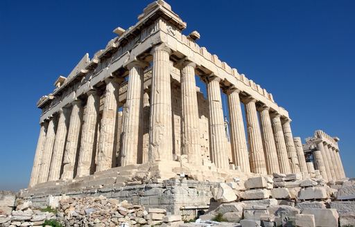 Greek temple ruins against blue sky