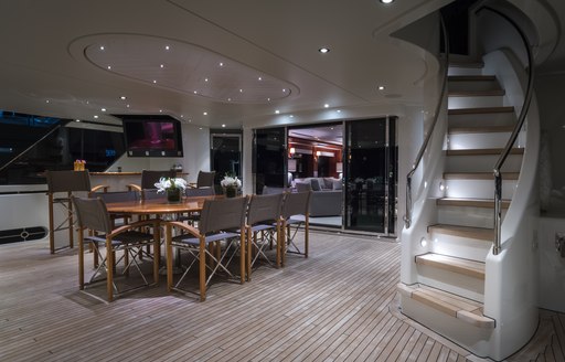 A dining table arranged on the exterior of a superyacht