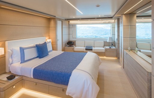 master suite with oak panelling and large windows aboard superyacht NARVALO 