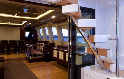 view of staircase and interior dining on board superyacht QUANTUM 