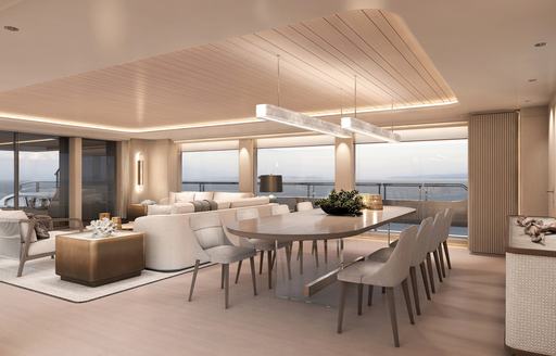 Dining area with long table and white chairs onboard charter yacht MEMORIES