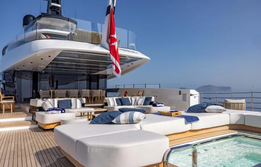 Exterior seating and a Jacuzzi onboard charter yacht ACQUA CHIARA