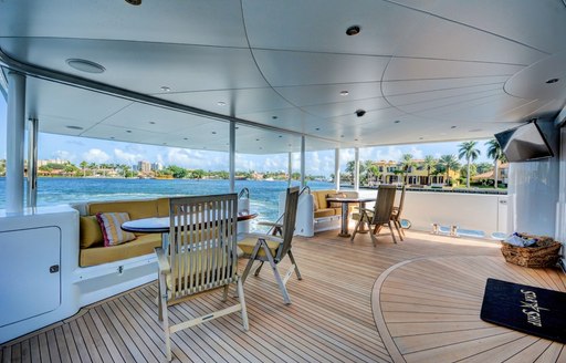 seating areas on the teak-clad main deck aft of luxury yacht STARSHIP 