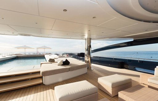 pool on luna yacht, with sunpads and cushions