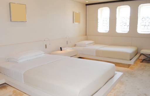 Twin cabin onboard charter yacht AIR with two single berths and a window