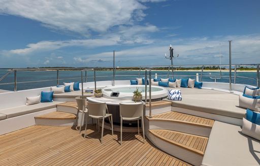 Charter yacht KEFI sun deck with Jacuzzi and sun pads
