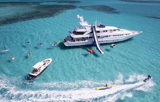 heesen yacht at last aerial view with slide and toys in the bahamas