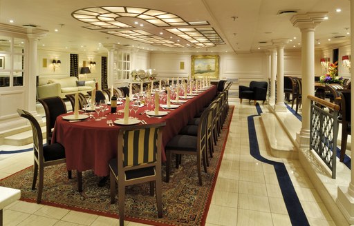 Formal dining salon on superyacht Christina O