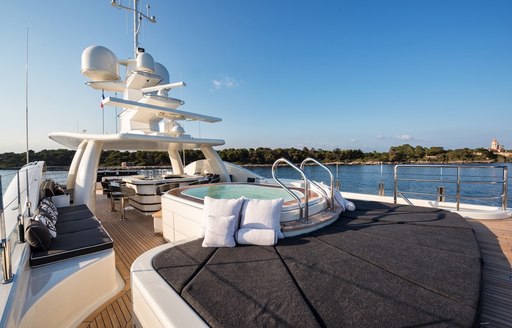 sun pads and Jacuzzi on the sundeck aboard charter yacht ELIXIR