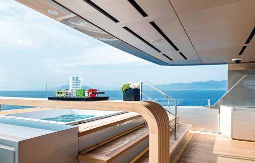 sundeck pool on motor yacht giraud, with bar area adjoining 