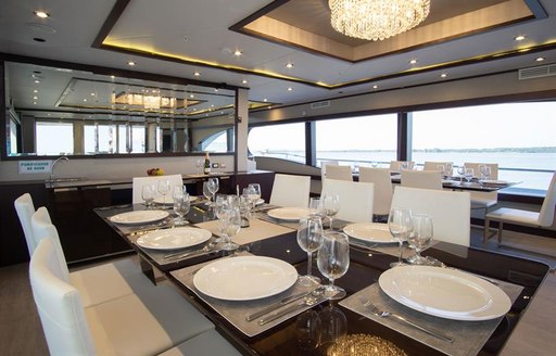 Formal dining table laid out on motor yacht Grand Daphne