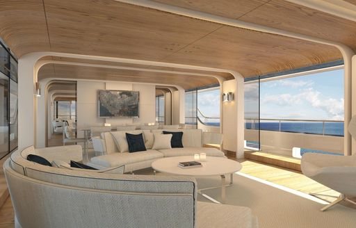 Interior lounge area with white seating surrounded by large windows onboard charter yacht DAWO