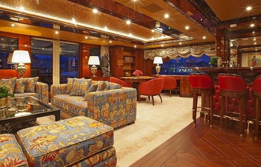 classical styled skylounge with bar, sofas and games table aboard motor yacht ULYSSES 