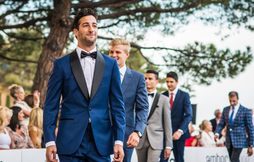 F1 drivers on catwalk at amber lounge fashion show in monaco during monaco grand prix