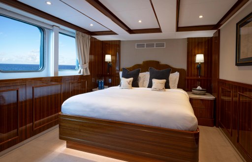 Charter yacht AQUA LARES guest cabin with central berth