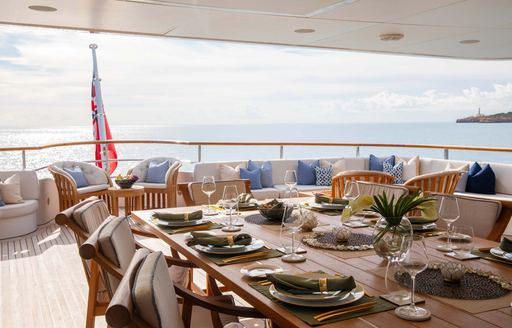 Exterior dining area onboard charter yacht LA BLANCA