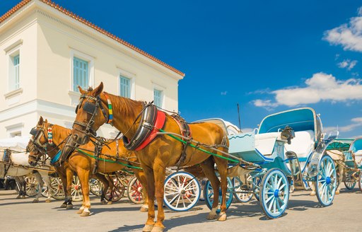 Horse-drawn carriages on the island of Spetses in the Saronic Islands, Greece
