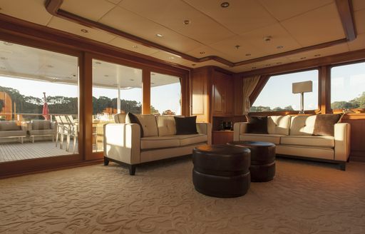 sofas form a seating area in a salon aboard charter yacht RELENTLESS 