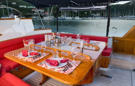 alfresco dining area on board luxury yacht MUSTANG
