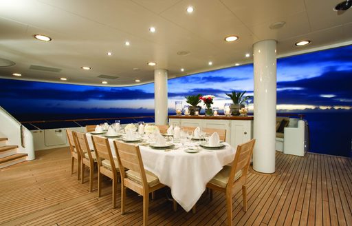 The alfresco dining section on board Feadship superyacht UTOPIA