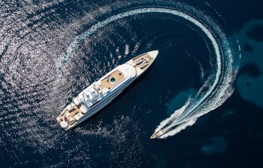 aerial view of superyacht ‘Coral Ocean’ cruising with tender in the Mediterranean