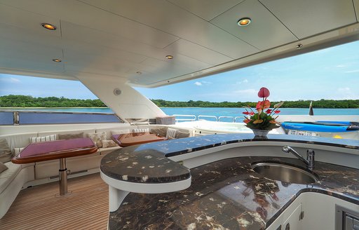 bar and seating area on the flybridge of luxury yacht ENCORE 