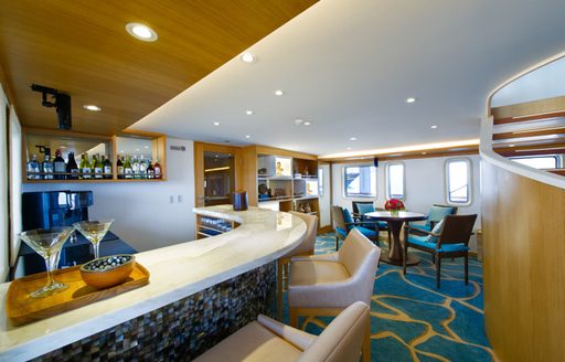 bar and seating in the skylounge aboard charter yacht SALILA