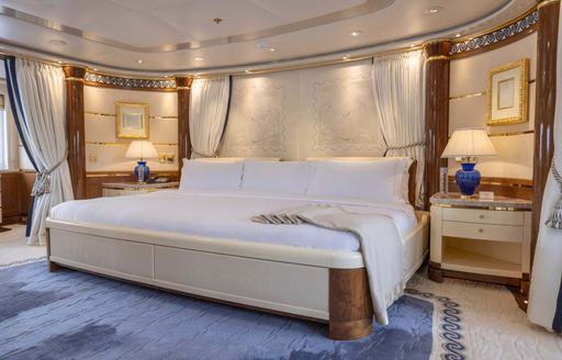 Huge central berth in the master cabin onboard charter yacht OLYMPUS